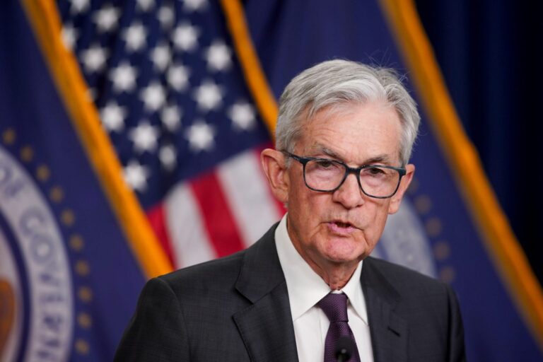 Fed keeps interest rates steady after a stock market sell-off and a brewing trade war